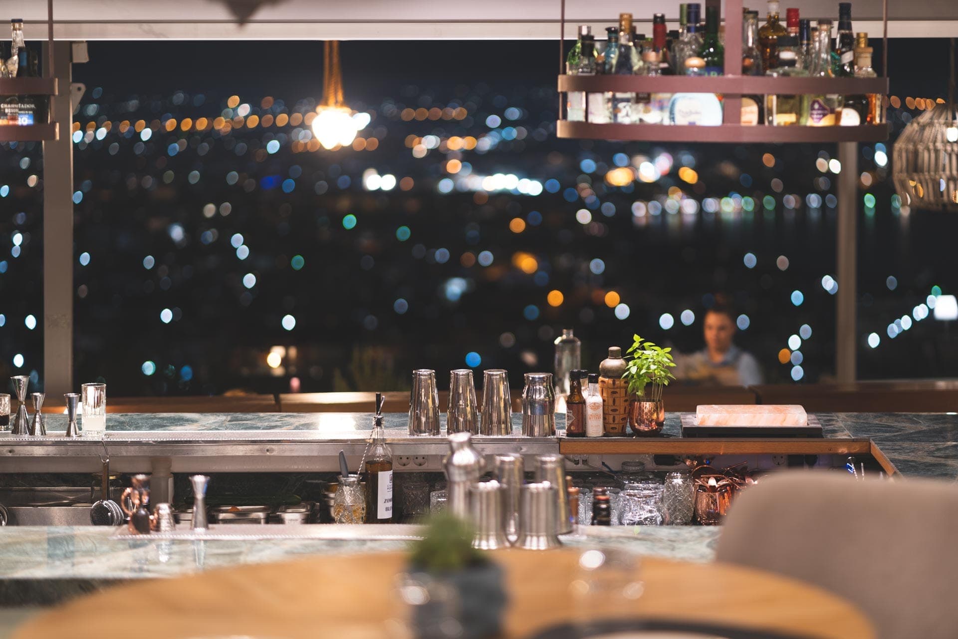 Night on the terrace above the glittering bay.